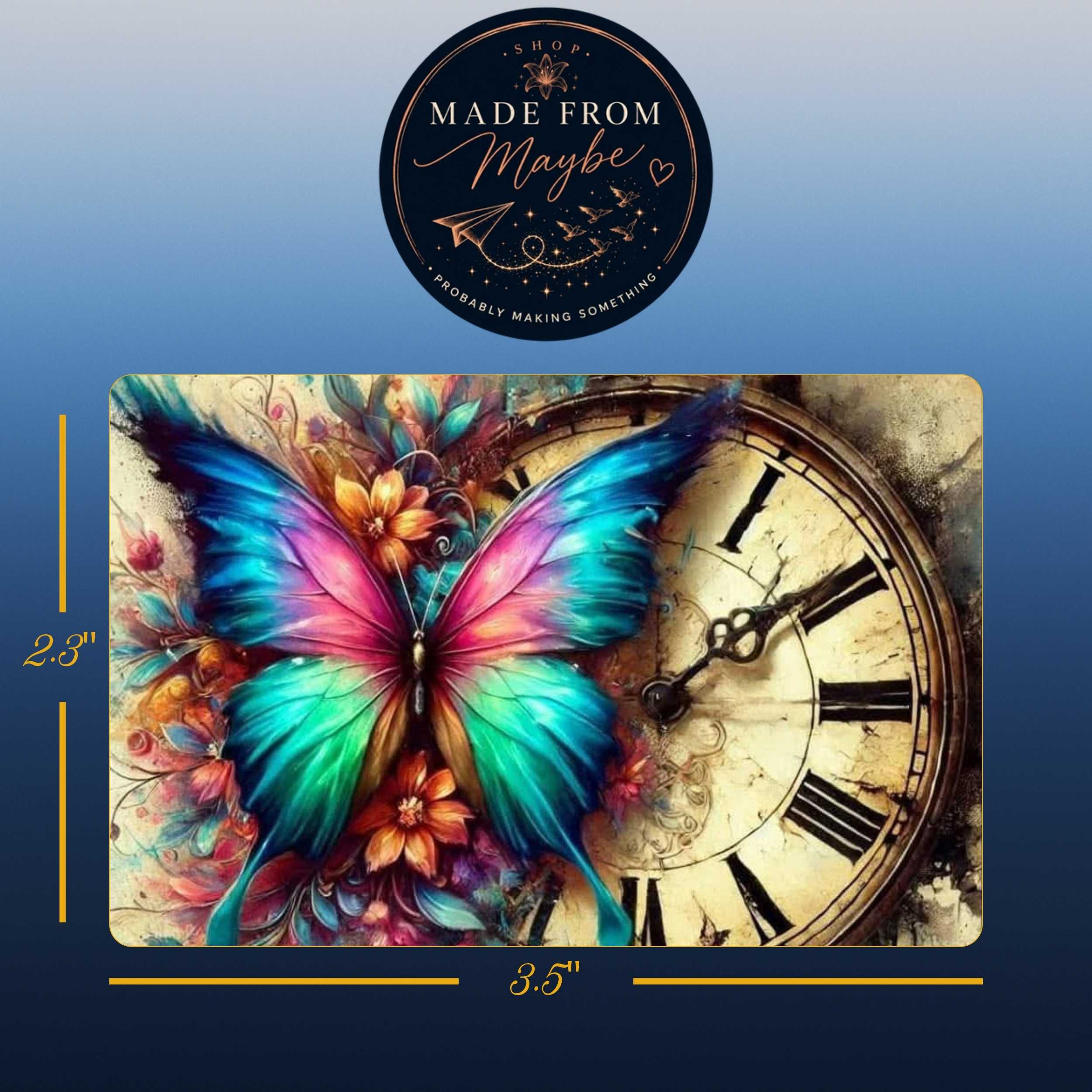 A rectangular wall art print or canvas featuring a colorful butterfly over a vintage clock face, shown with dimension labels of 23 by 35 inches and a circular 'Made from Maybe' logo at the top on a blue gradient background.